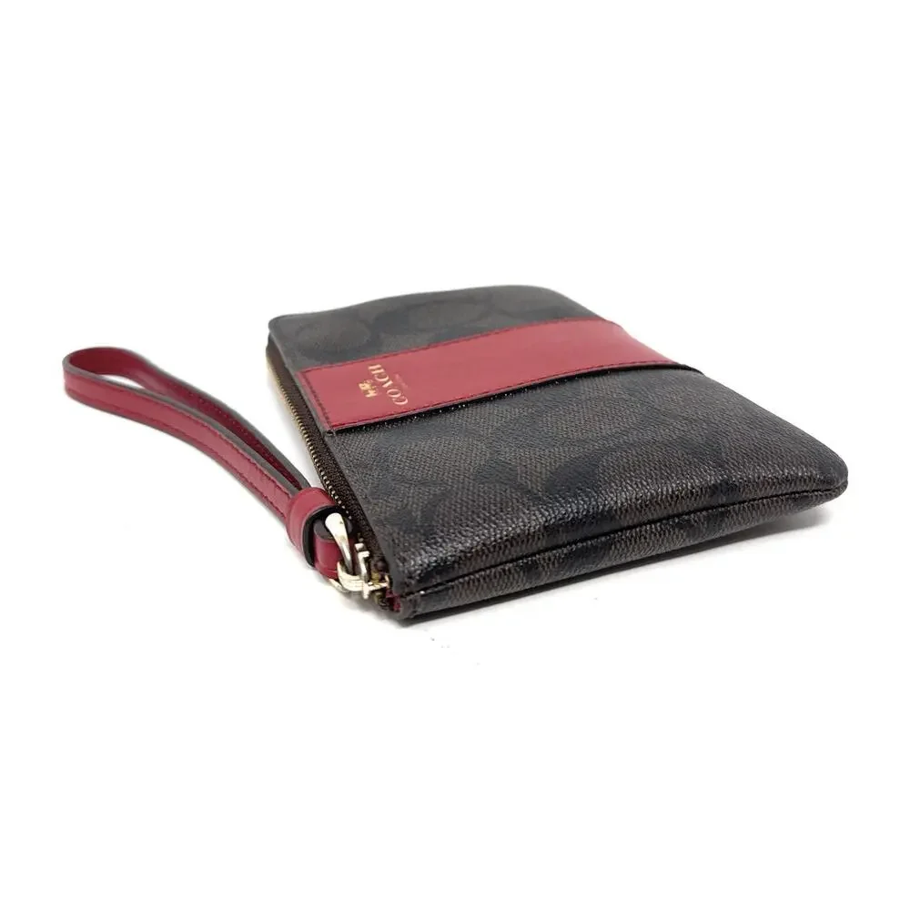 Coach Corner Zip Wristlet In Signature Canvas Brown Red